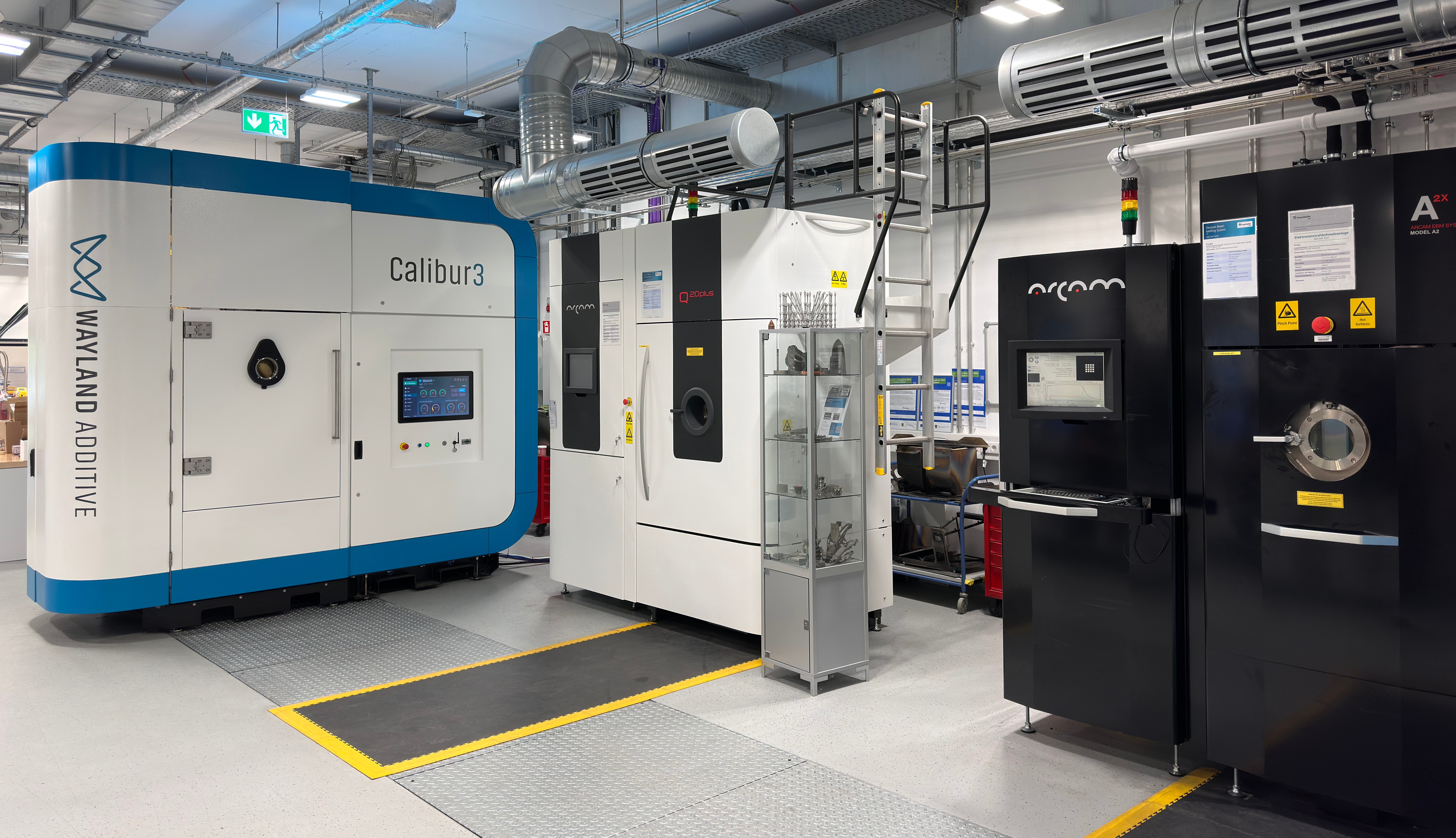View into the Innovation Center Additive Manufacturing ICAM® with all three facilities for Electron Beam Powder Bed Fusion (PBF-EB) View into the Innovation Center Additive Manufacturing ICAM® with all three facilities for Electron Beam Powder Bed Fusion (PBF-EB)