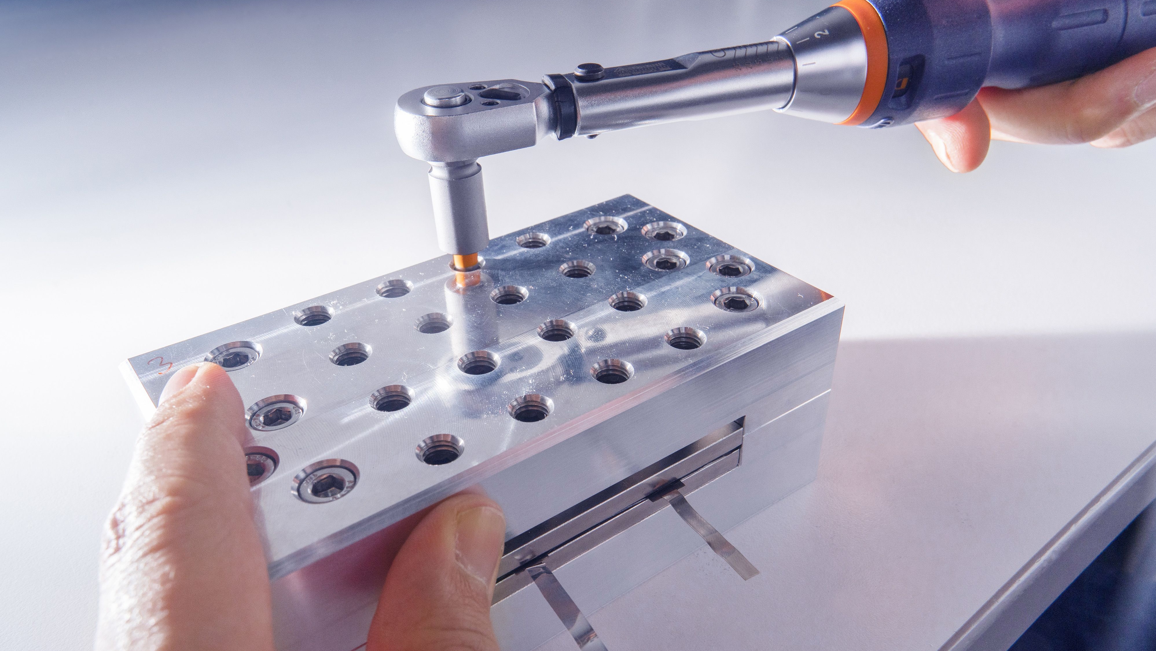 Pressure setup for solid-state battery cycling.